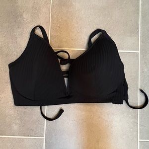 Black push-up swim top with ties. NWT